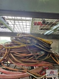 Assortment of extension cords on wire shelf