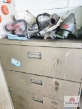 tan metal cabinet and contents