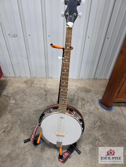 Remo banjo with stand and strap