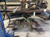 Heavy hydraulic lift table, approx 4 in. x 6 in. ; nothing on top