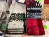 2 metal boxes of drill bits