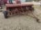 McCormick low rubber grain drill w/ grass seeder,
