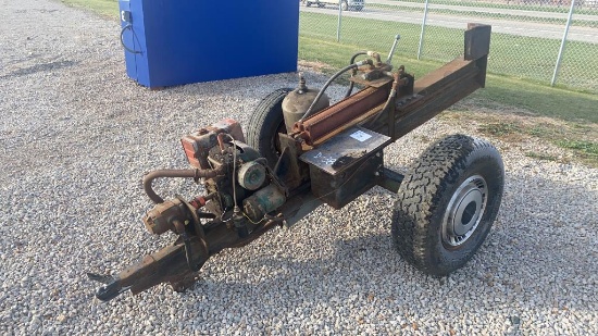 Log splitter, gasoline engine, on wheels.