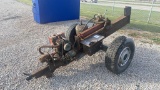 Log splitter, gasoline engine, on wheels.