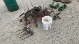 pile of spring harrow teeth w/ mounting brackets