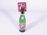 1950s 7-up cardboard store bottle topper display with original glass bottle. Size: 3.5