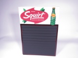Mint 1968 Squirt Soda single-sided embossed tin diner menu board sign with bottle graphic. Size: 19.