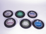 Lot of six 1930s-70s automotive garage tire-shaped promotional ashtrays. Brands such as BF Goodrich,