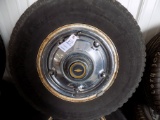 Factory Chevy C10 rims and tires with hub caps