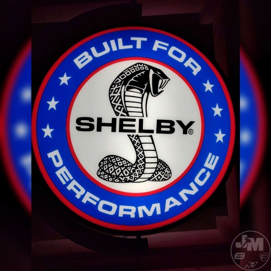 ROTATING SHELBY LED DOUBLE-SIDED FLANGE SIGN. APPROXIMATELY 20" ACROSS (26"