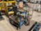 2 METAL ROLLING CARTS, ELECTRICAL CORDS, SMALL BATTERY CHARGER, LIGHTS