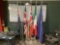5 FLAGS ON POLES, 1 EMPTY FLAG POLE