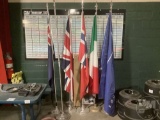 5 FLAGS ON POLES, 1 EMPTY FLAG POLE