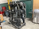 ROLLING RACK OF DIFFERENT SIZE HYDRAULIC HOSES,TWO METAL RACKS WITH