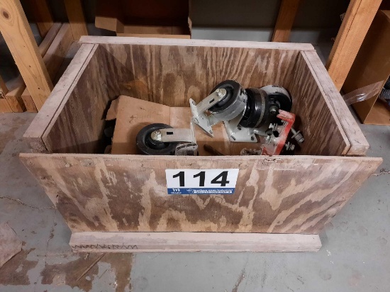 WOODEN CRATE FULL OF CASTER WHEELS