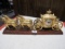 gold colored stagecoach clock