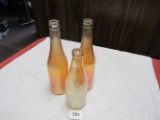 3 carnival glass pop bottles