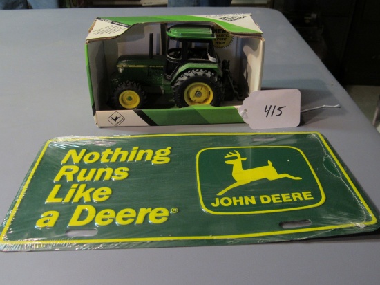diecast JD utility tractor W/box & JD metal license plate