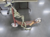 Skeleton riding 2 wheel scooter