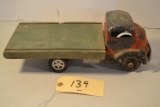 antique Smitty metal truck with wood flatbed