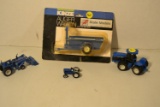 Blue diecast mini farm tractors and implements