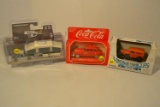 diecast vehicles (1930 Chevy truck, 1970 Ford with trailer, Chrysler Windsor)