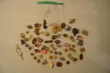 Assortment military cufflinks, buttons, lapel pins and a metal solider