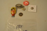 Assortment pins, a clapper and key ring ornaments