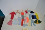 assortment of vintage Barbie clothes
