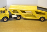 yellow Tonka mighty car trailer and Tonka semi truck cab