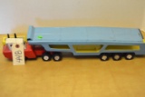 metal blue car carrier & red truck cab