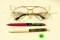 Vintage safety glasses & 2 pens w/movable scenes