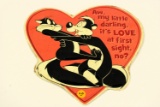 Metal heart-shaped Pepe Le Pew sign