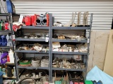 A group of assorted Pipe clamps, Strong Ties, and Filters across 8 levels of shelving