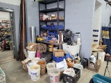 An assorted group of Metal hardware across shelving, milk crates, and buckets