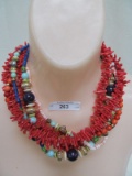 MULTI STRAND NECKLACE WITH SHELL CLASP