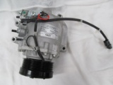 AIR CONDITIONER COMPRESSOR (SEE PICTURES FOR DENT)