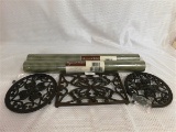 3 CAST IRON TRIVETS & 2 DOUBLE ROLLS OF WALLPAPER