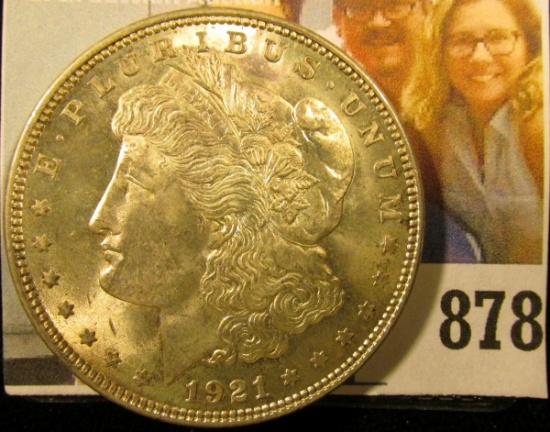 1921 P U.S. Morgan Silver Dollar, Brilliant Uncirculated. Light gold toning.