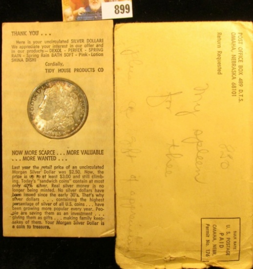 1885 O Brilliantly toned Uncirculated Morgan Silver Dollar in an original Tidy House cardboard holde