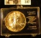 1987 U.S. American Eagle Silver Dollar, lightly toned Gem BU in a special plastic case.
