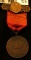 Badge with High grade Indian Cent, ribbon, & hangar 