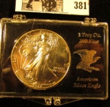 1987 U.S. American Eagle Silver Dollar, lightly toned Gem BU in a special plastic case.
