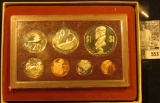1975 Cook Islands 7-Coin Proof Set with One Dollar Coin, which depicts the Fertility God. Original a