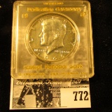 1966 Brilliant Uncirculated Kennedy Half Dollar in a Snap-tight case labeled with gold lettering 