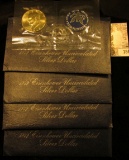 (4) 1972 S Silver Eisenhower Dollars in original blue packs of issue. All Gem BU.
