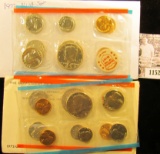 1152 . Pair of 1972 U.S. Mint Sets, both in original cellophane, one in original envelope.