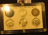 1023 . “United States Type Half Dollar” Capital holder containing 1861 S Good; 1897 P VG, 1943 P EF-