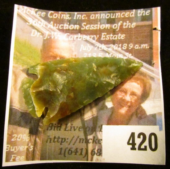Arrowhead made of transluscent green and brown quartz