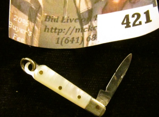 Miniature pocket knife with mother of pearl handle, blade marked GERMANY, total length 2”, blade len
